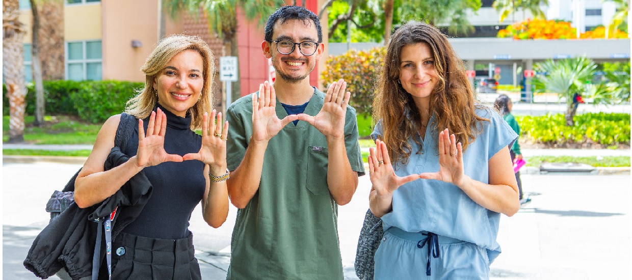 UM U sign with hands