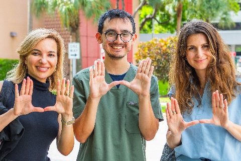 UM U sign with hands