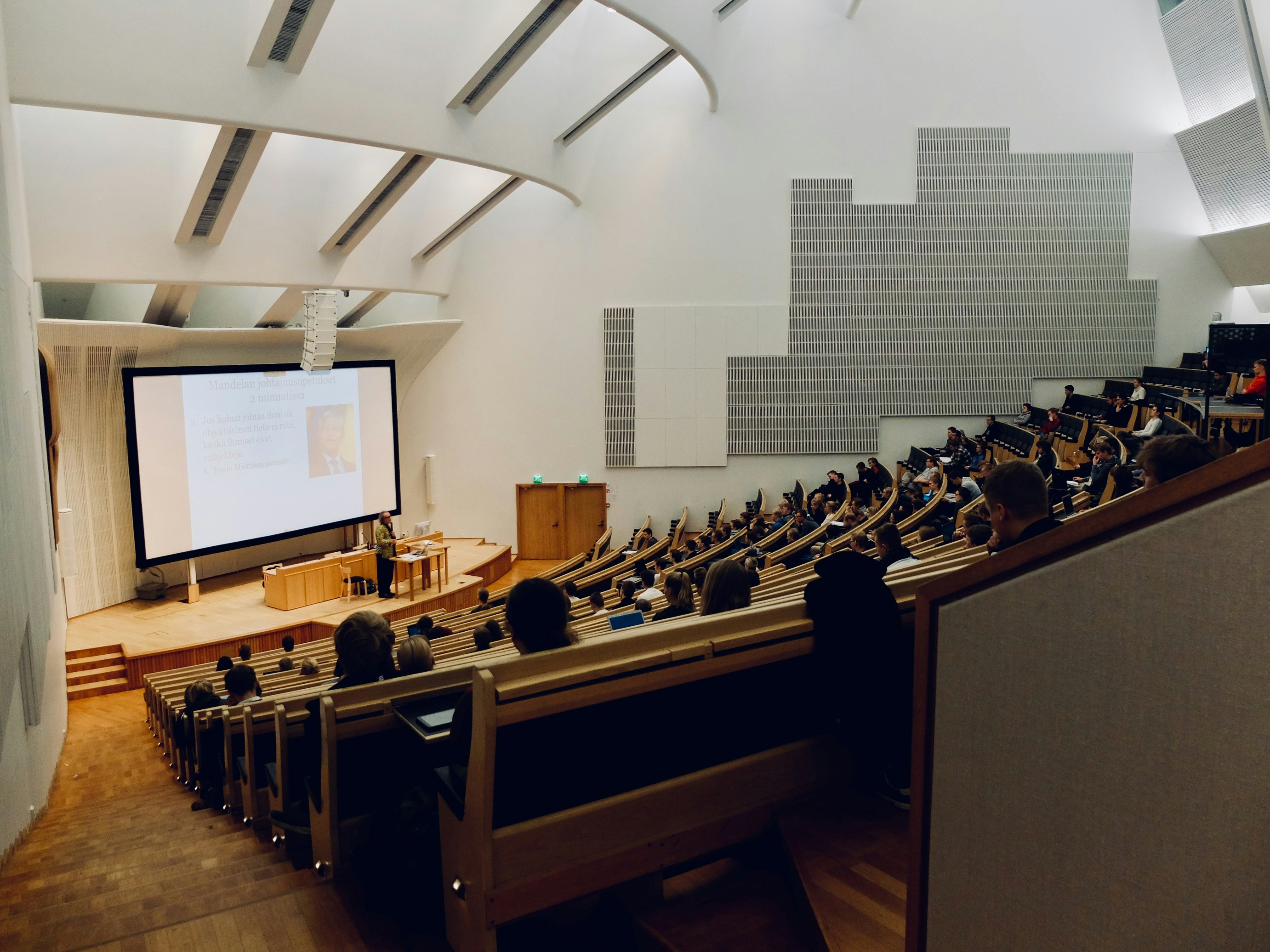 Students watching a presentaiton in an auditorium